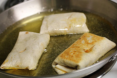 Frying rolled and stuffed tortillas for chimichangas