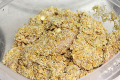Battered chicken strips coated and ready to fry