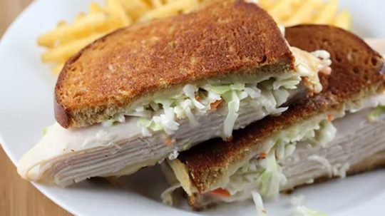 Close up view of turkey Reuben sandwich.