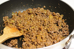 Skillet of cooked ground beef with onions and peppers