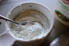 Bowl of creamy ranch dipping sauce with spoon inside