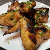 Close-up view of prepared honey mustard chicken wings.