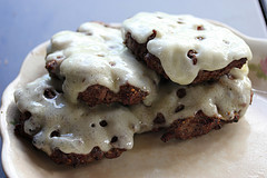 Burger patties topped with melted cheese on a plate