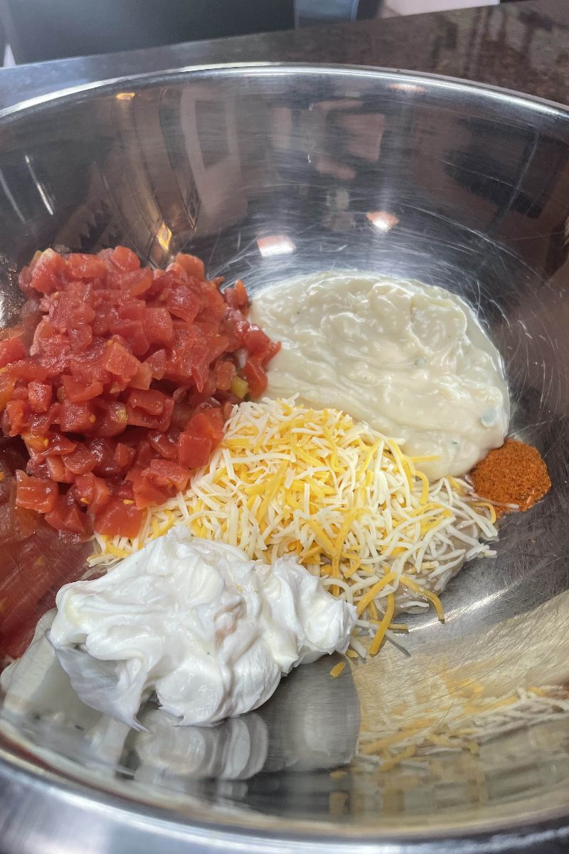 Ingredients for Dorito chicken casserole in a bowl.