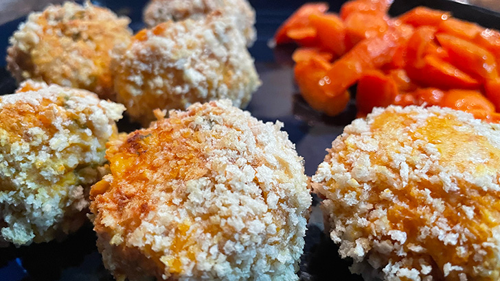 Close up of buffalo chicken bites on plate.