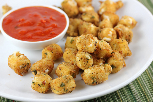 Fried mozzarella cheese bites served with marinara dipping sauce