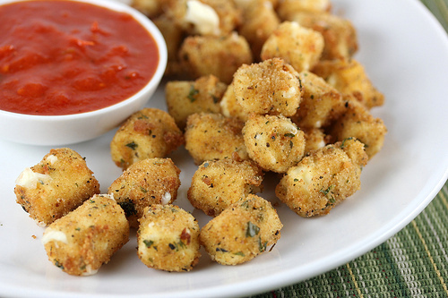 Fried mozzarella cheese bites served with marinara dipping sauce