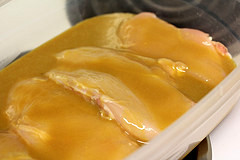 Chicken breasts in a dish covered with honey mustard sauce
