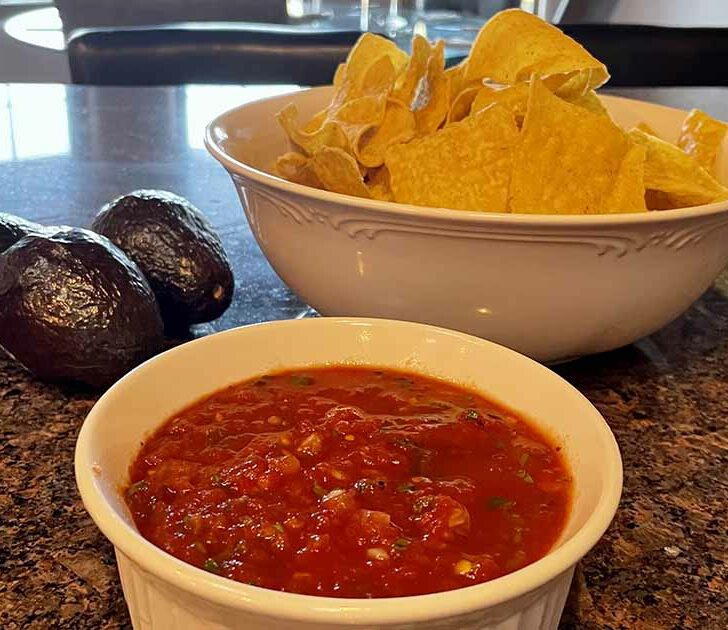 Close-up view of Chili's salsa recipe, prepared and served in white dish.