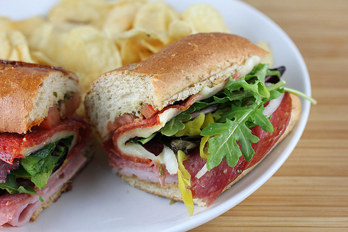 Quiznos classic Italian sandwich with meat cheese and vegetables on a sub roll.
