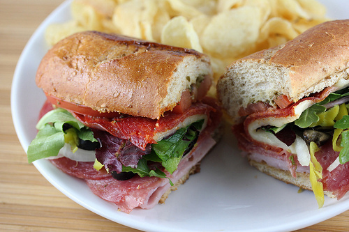 Quiznos classic Italian sandwich with meat cheese and vegetables on a sub roll.