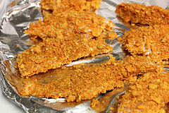 Freshly baked Doritos chicken strips on a tray