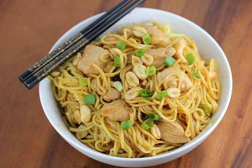 Charlie chan chicken pasta served in a white bowl