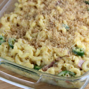 Casserole dish filled with baked jalapeño mac and cheese topped with breadcrumbs