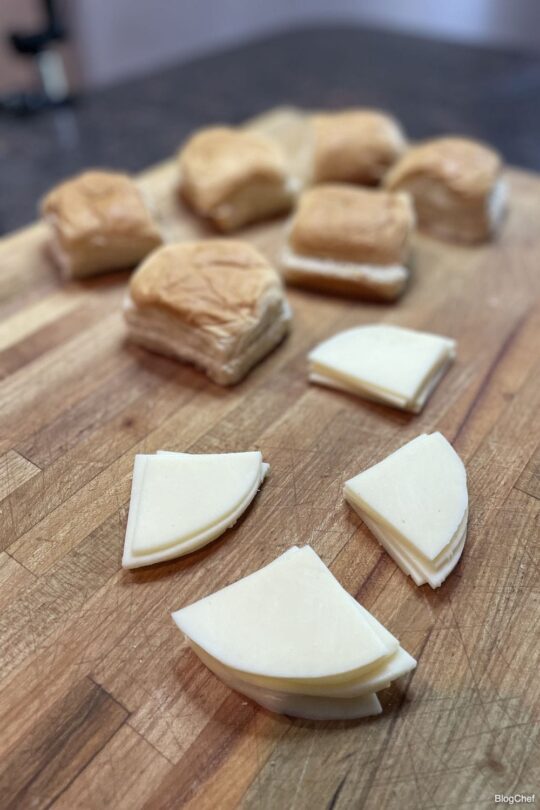 Cheese and rolls for turkey and cheese sliders with poppy seed sauce.