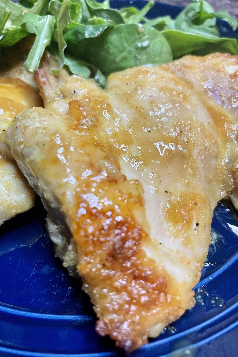 Baked chicken thighs recipe, prepared for serving.