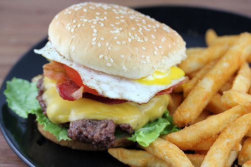 Royal Red Robin Burger with fries on a black plate