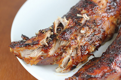 Glazed pork tenderloins on a white plate