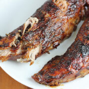 Glazed pork tenderloins on a white plate