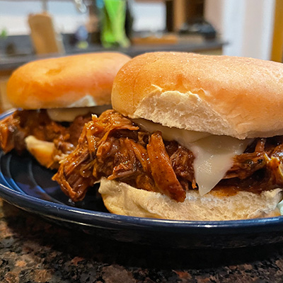 Close up of slow cooker Italian beef sliders.