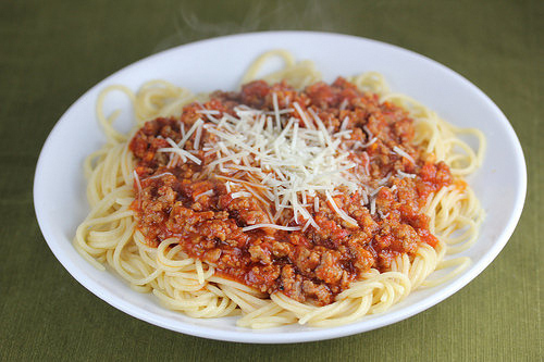 Olive Garden bolognese served over spaghetti with cheese.