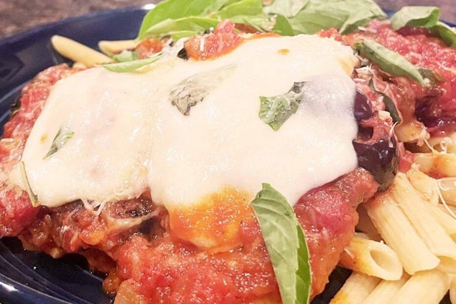 Prepared grilled chicken Parmesan.