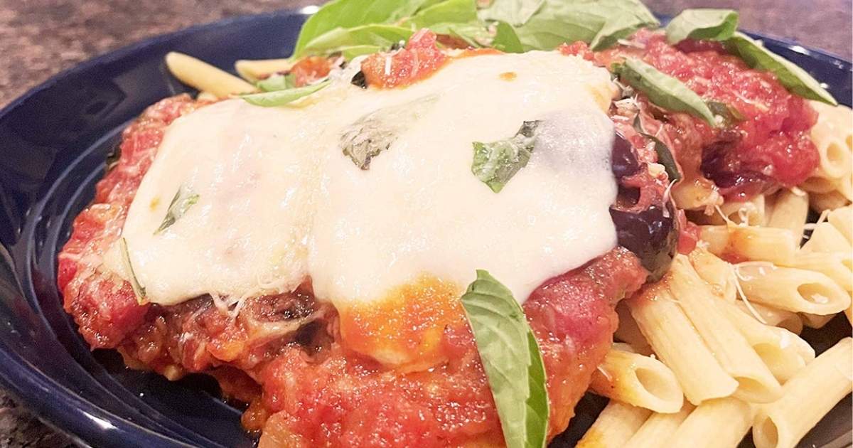 Prepared grilled chicken Parmesan.