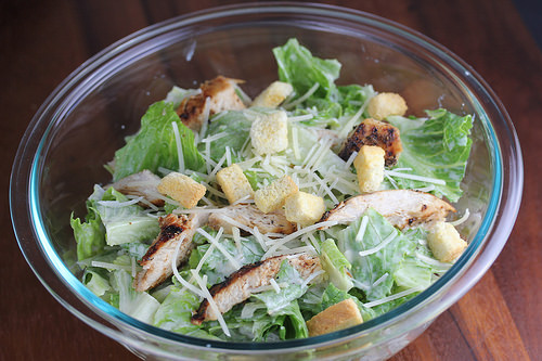 Here’s a concise and SEO-friendly alt tag with no period that works for both images:
**Homemade caesar salad with croutons parmesan and grilled chicken in a glass bowl