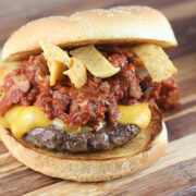 Frito cheeseburger with melted cheese and chips in a bun
