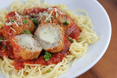 Turkey meatballs stuffed with melted mozzarella served over spaghetti with marinara sauce and shredded parmesan