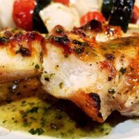 Grilled chicken skewers with roasted garlic vinaigrette.