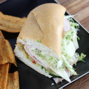 Beach club sandwich with turkey avocado sprouts and fresh vegetables on sub roll