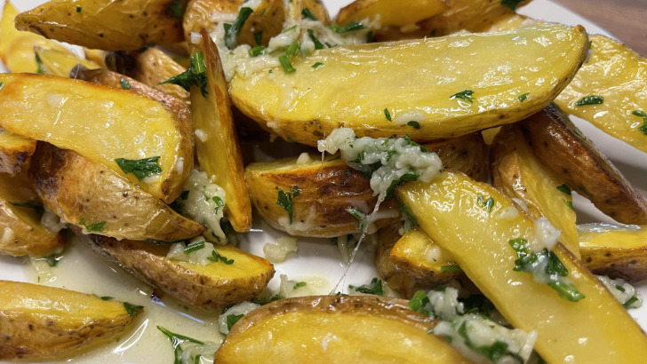 Close-up view of Red Robin garlic Parmesan fries.