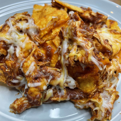 Doritos chicken nachos, prepared on a plate.