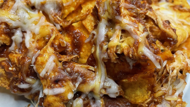 Doritos chicken nachos, prepared on a plate.