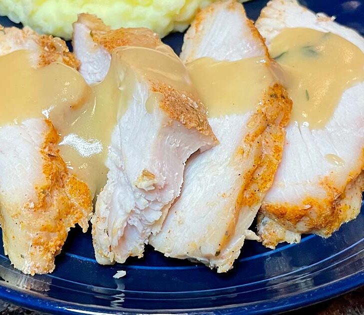 Slow cooker turkey breast, prepared and sliced with gravy.