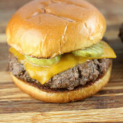 Culvers butter burger with cheddar cheese and pickles on a toasted bun