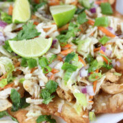 Wonton chicken nachos topped with lime and cilantro