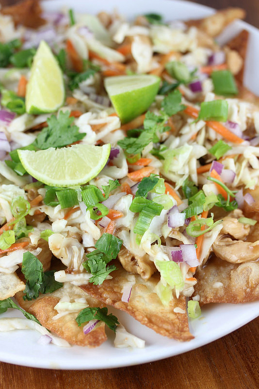 Wonton chicken nachos topped with lime and cilantro