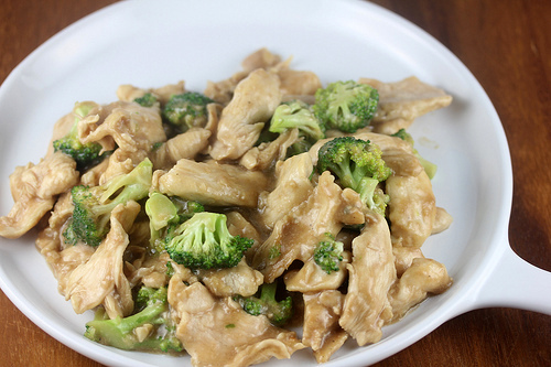 Chinese buffet broccoli chicken with savory sauce served in a white bowl