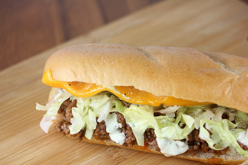 Turkey taco grinder sandwich with lettuce and cheese
