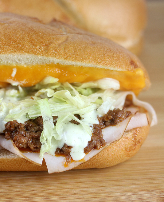 Turkey taco grinder sandwich with lettuce and cheese
