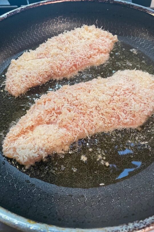Chicken Romano frying in saute pan.