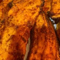 Close up of oven-baked yam wedges.