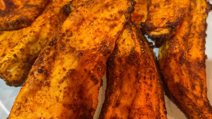 Close up of oven-baked yam wedges.