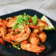 Cooked shrimp seasoned with herbs and spices served in bowl