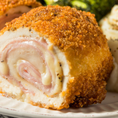 Close up view of prepared chicken cordon bleu.