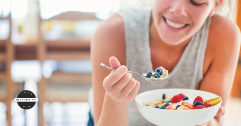 Smiling woman eats healthy food