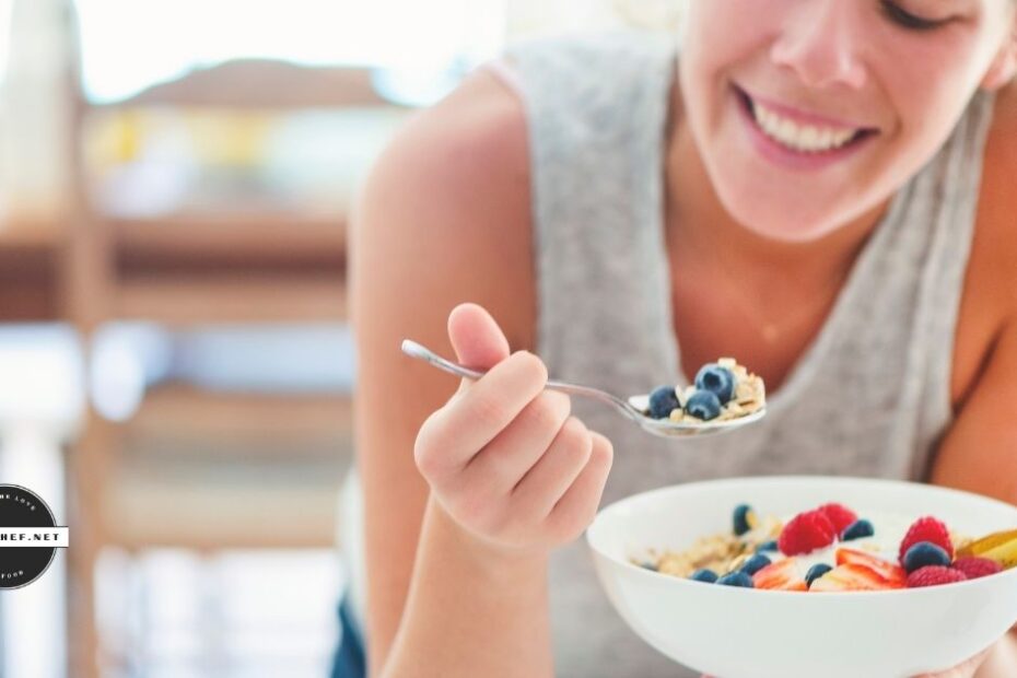 Smiling woman eats healthy food