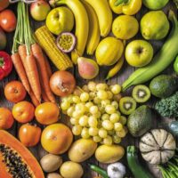 Raw fruits and vegetables from top view.